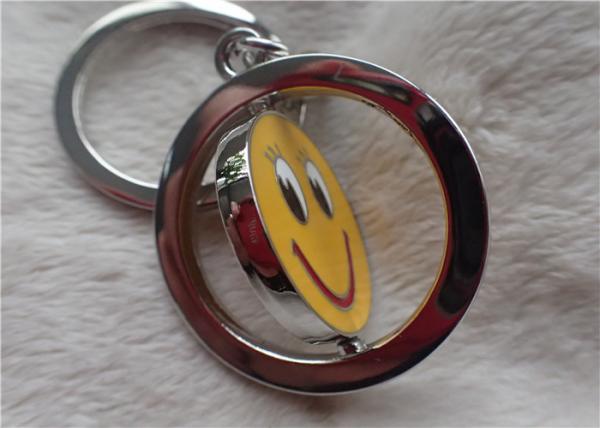 Quality Color Silver Key Chain Personalized Promotional Gifts With Rotatable Smiling Yellow Face for sale